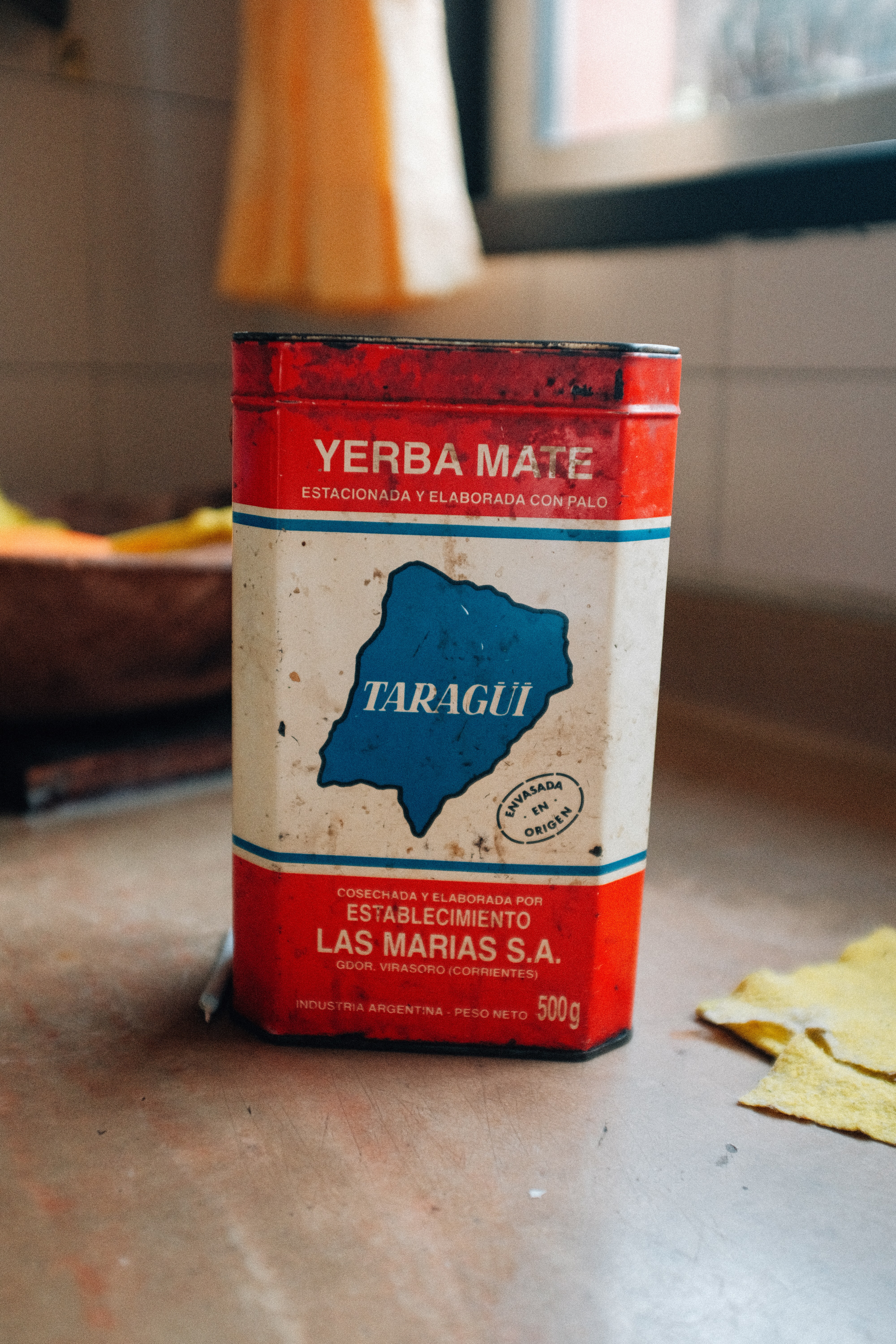 A can of yerba mate on a table.