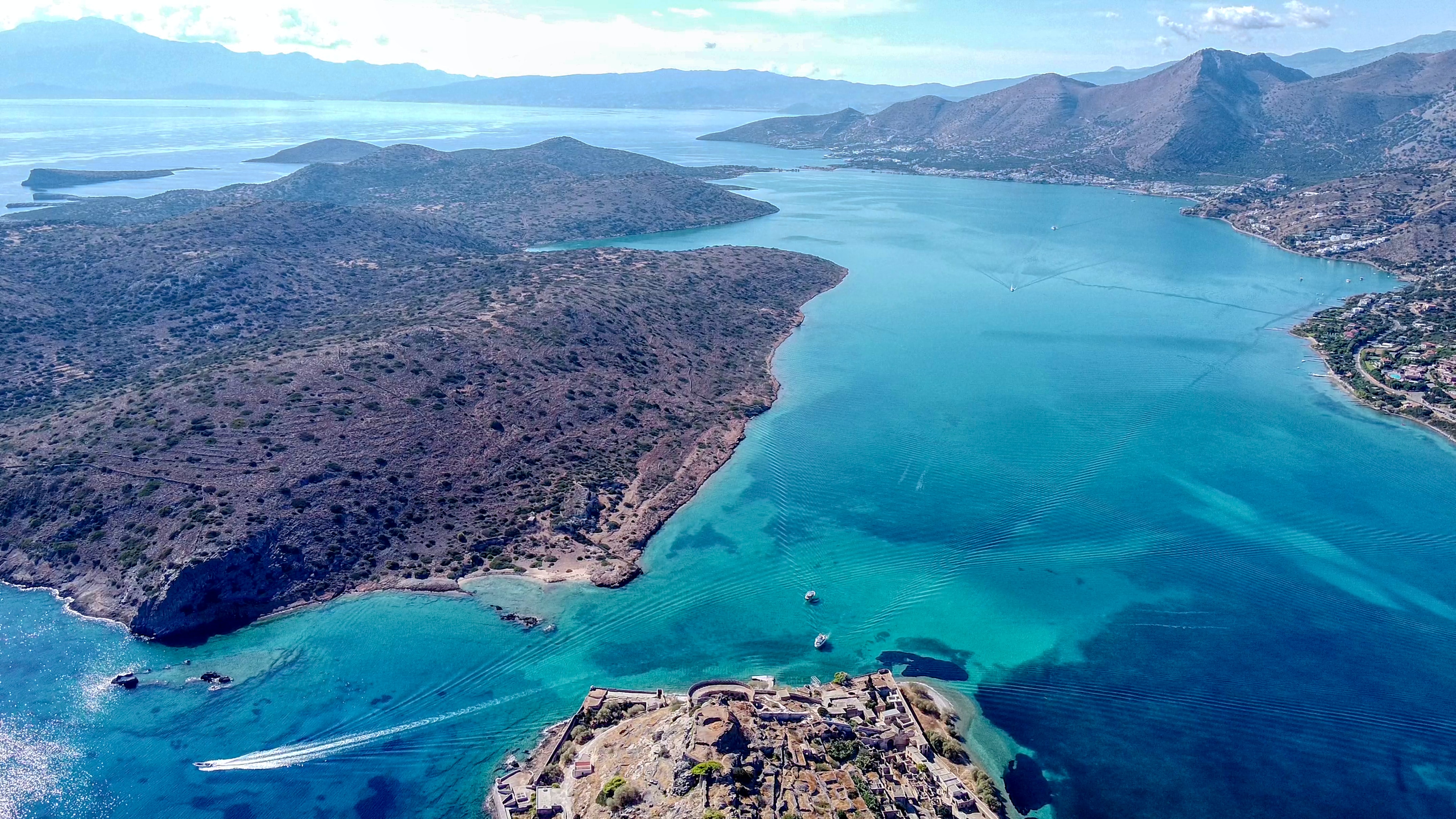 Greek islands with the turquoise blue waters surrounding.