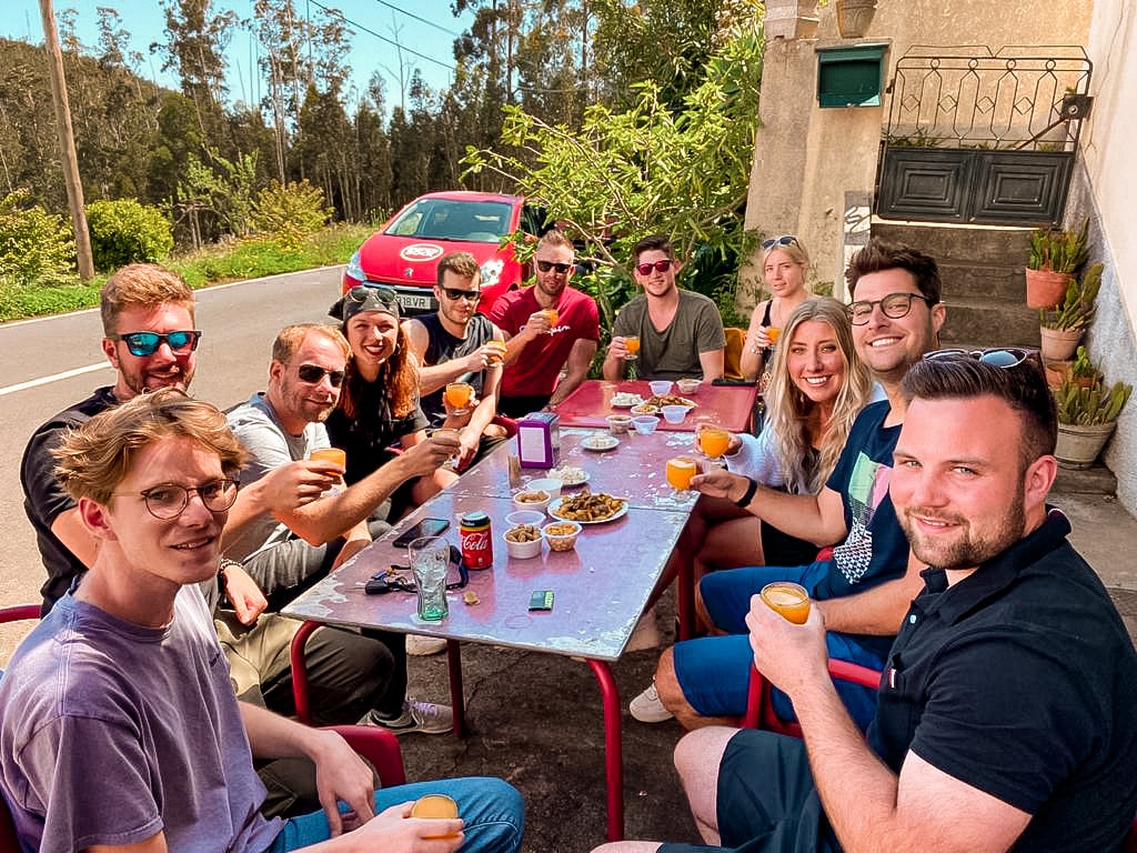 Group of travelers gathered together for a meal