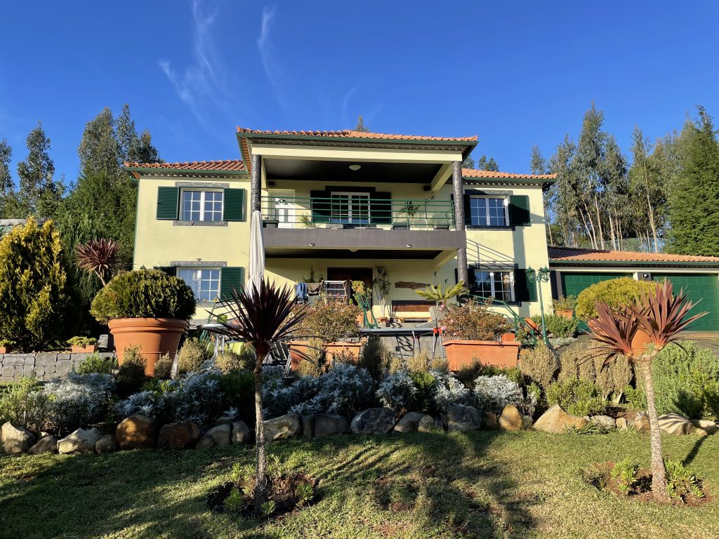 A yellow house in a tropical country on a clear day