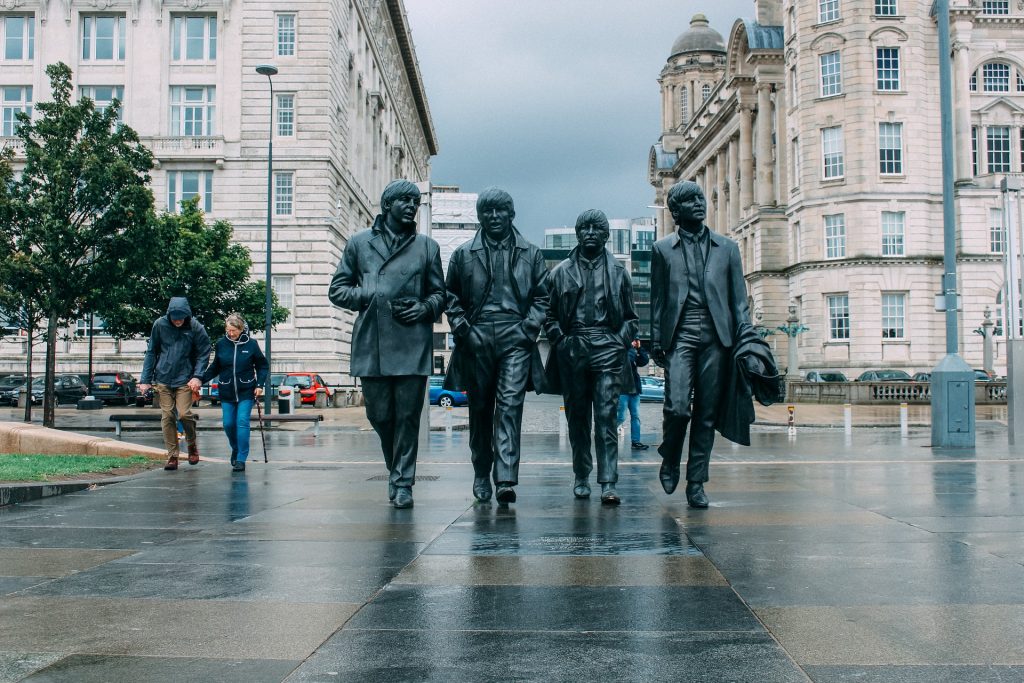 The Beatles bronze statue on a grey day in the city of Liverpool