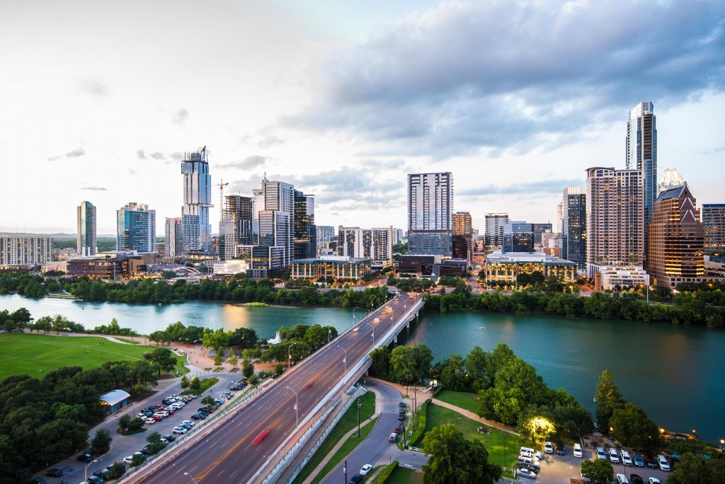 A city view of Austin, Texas in America with the river and bridge.