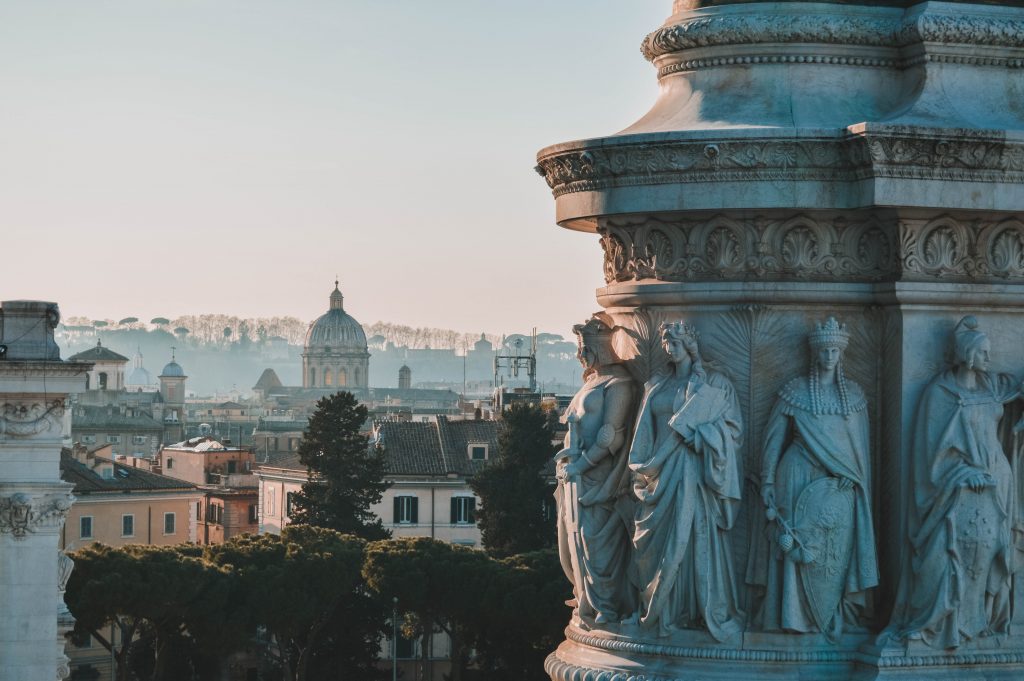 Rome is one of the best places to visit in Italy with statues and view of the city.