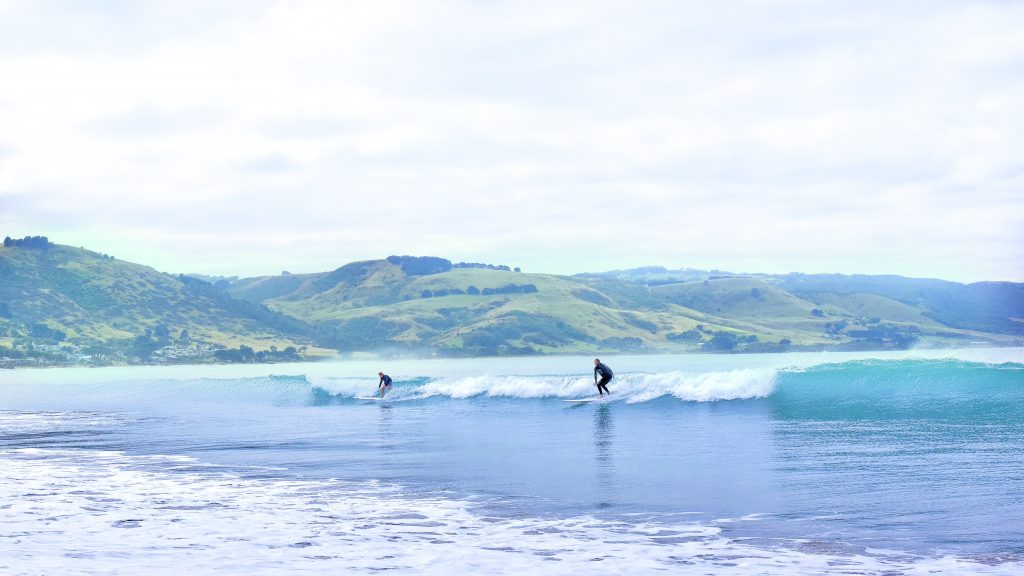 Valentine’s Trips For Singles in Australia surfing the waves