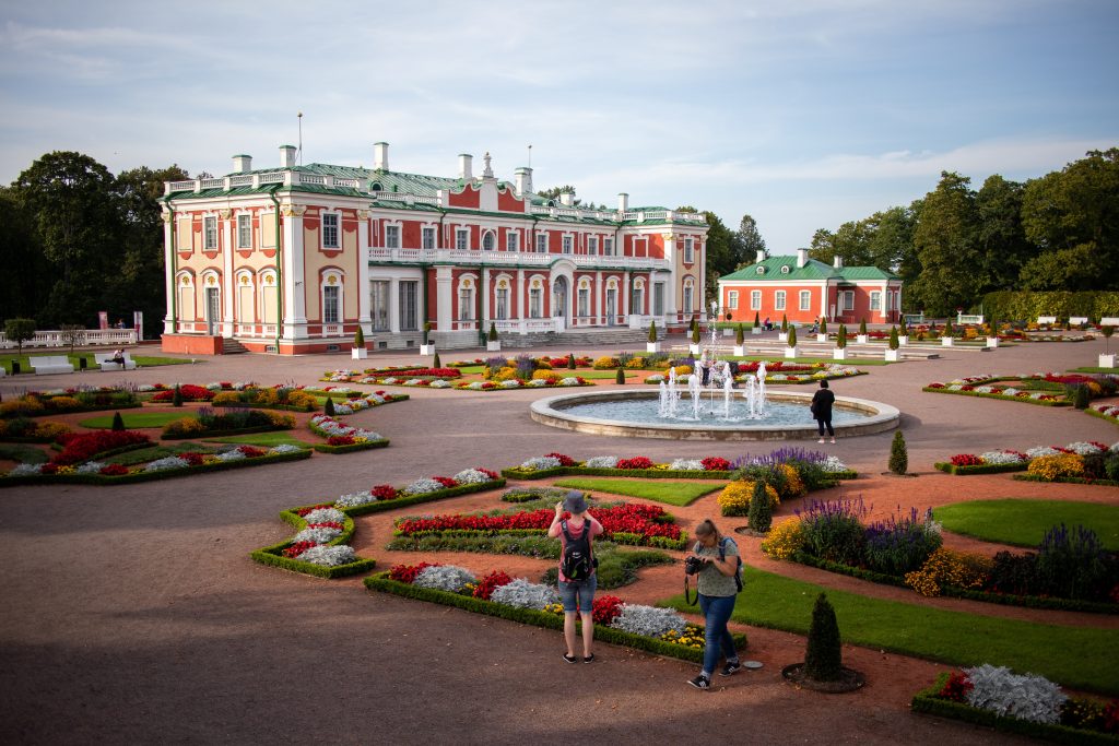 Red palace in Estonia surrounded by gardens