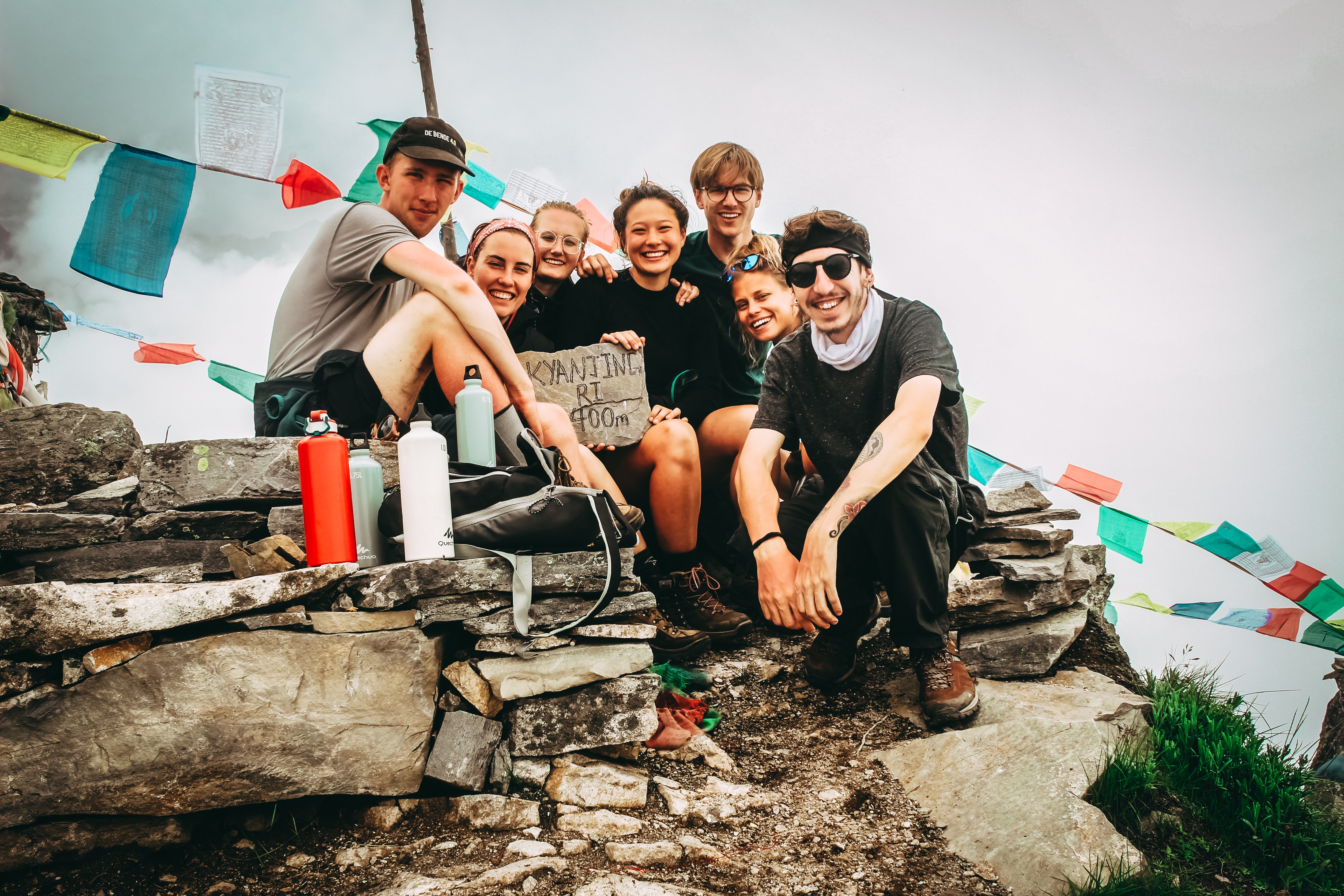 A group of travelers atop a mountain