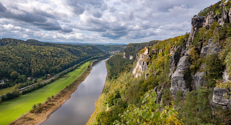 best place to visit in Germany, Sächsische Schweiz long river surrounded by mountains with clouds