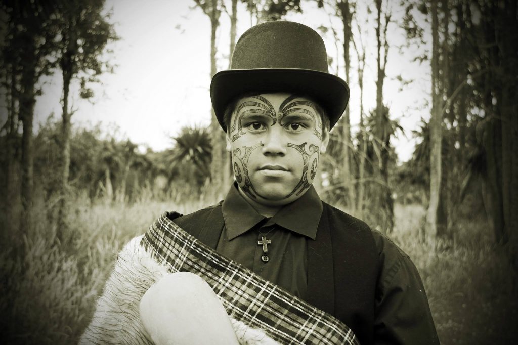 Maori person inNew Zealand posing in a black and white picture.