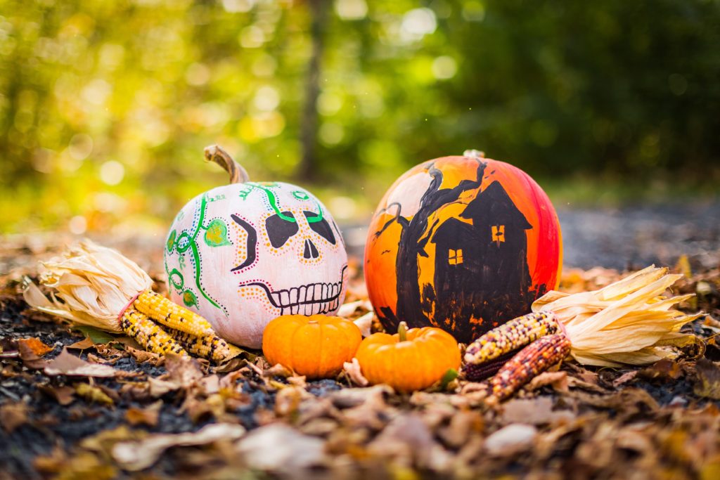 two painted pumpkins on Halloween