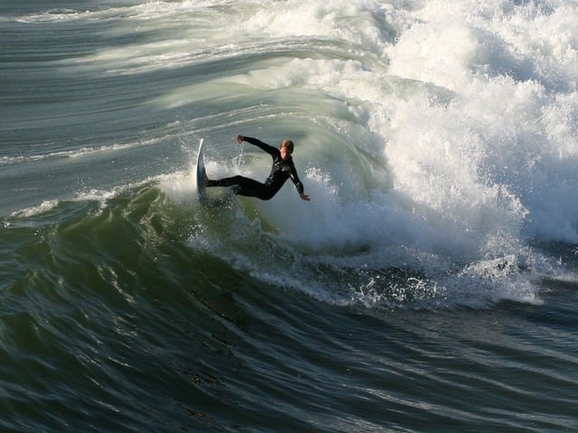 Surfer on the waves at Huntington Beach