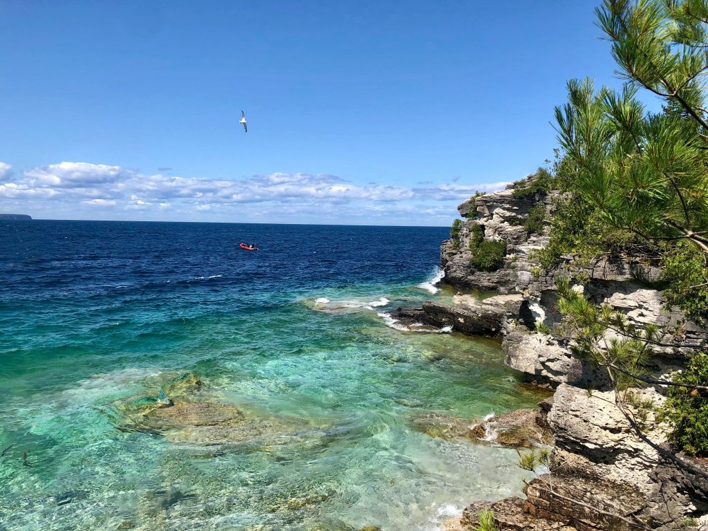 Rocky shores and blue water at Tobermory in Canada