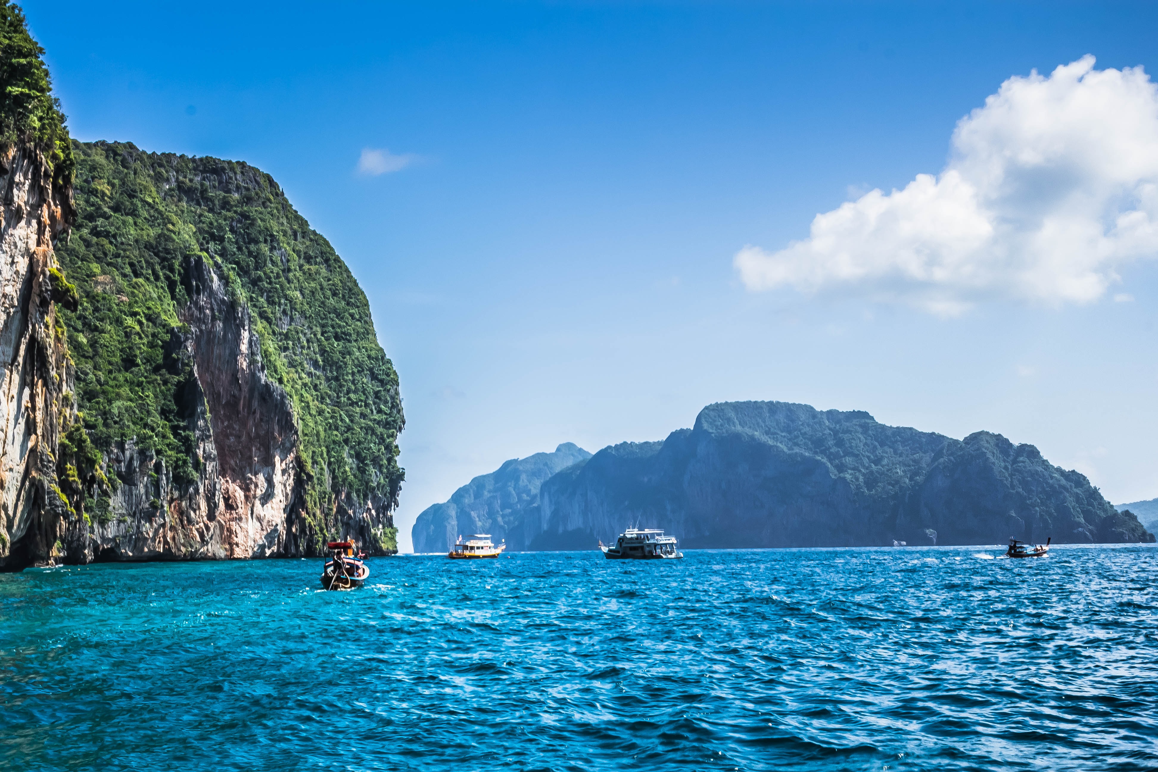 Phuket, Thailand with blue waters and boats.