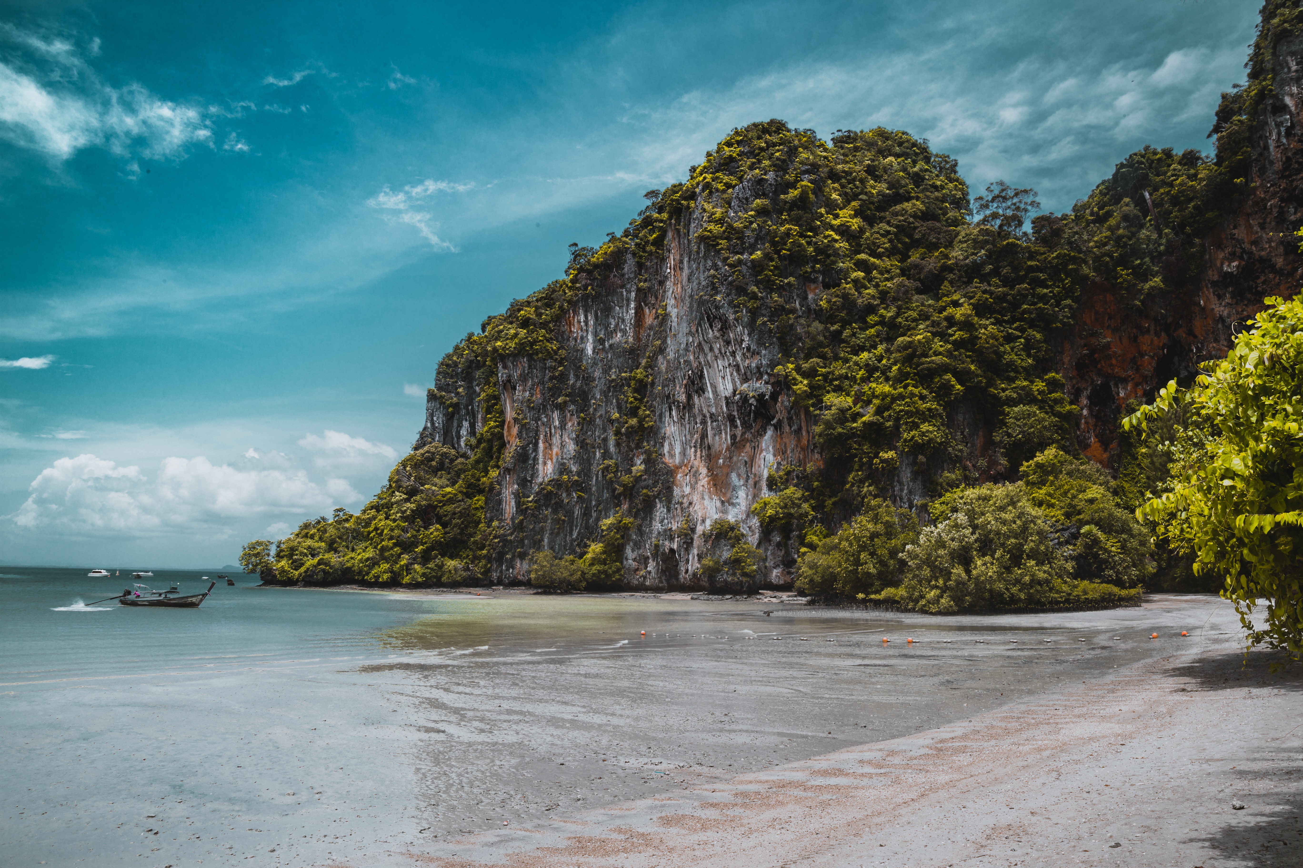 In Railay Beach, Thailand you climb in an incredible environment with lots of nature and surrounded by crystal clear water.