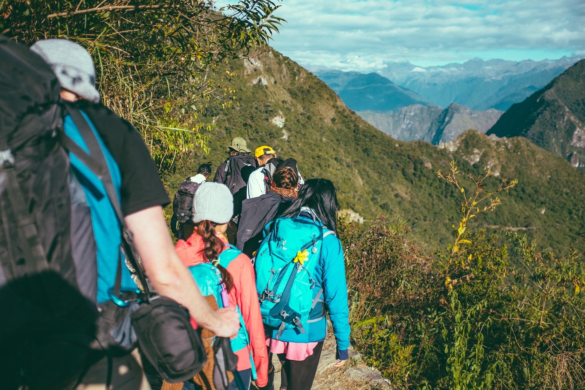 Group hikers hiking in the mountains on a clear day