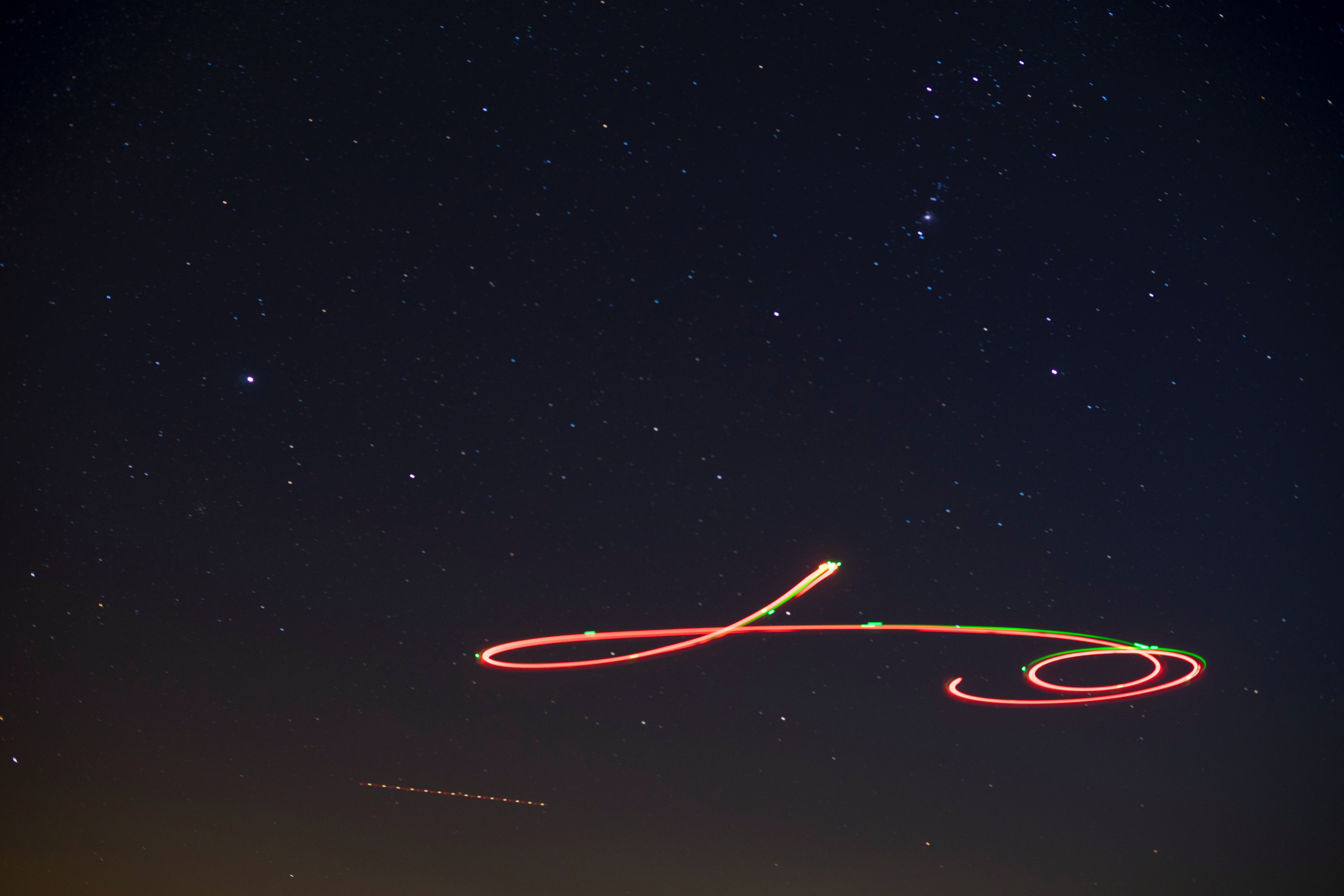 Fire ball shooting across starry sky