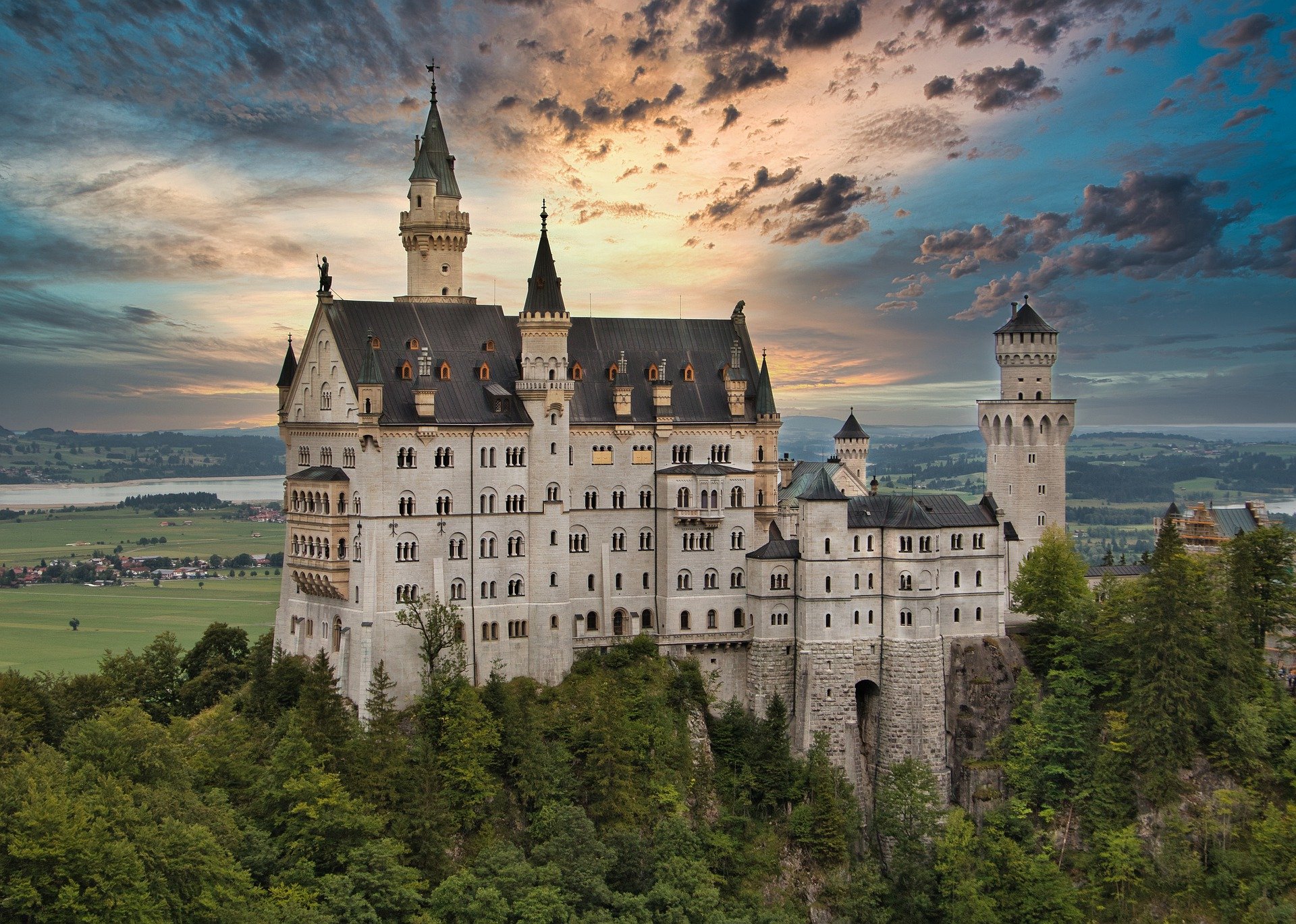 Massive white castle in Bavarian Germany with a cloudy sky