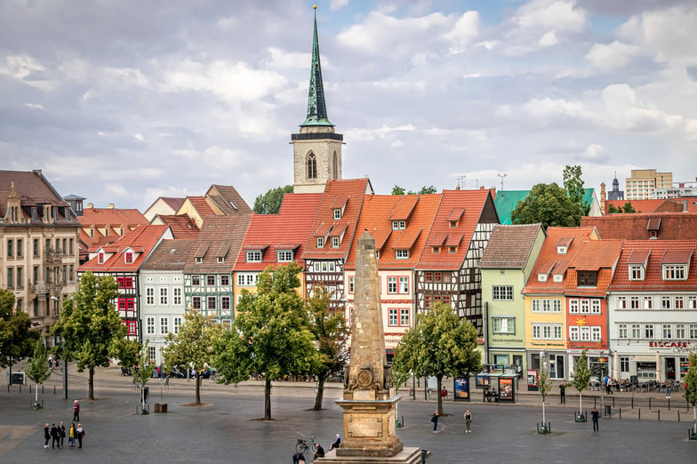 A city square in Germany with traditional red-roofed houses, one of the towns where Martin Luther once lived