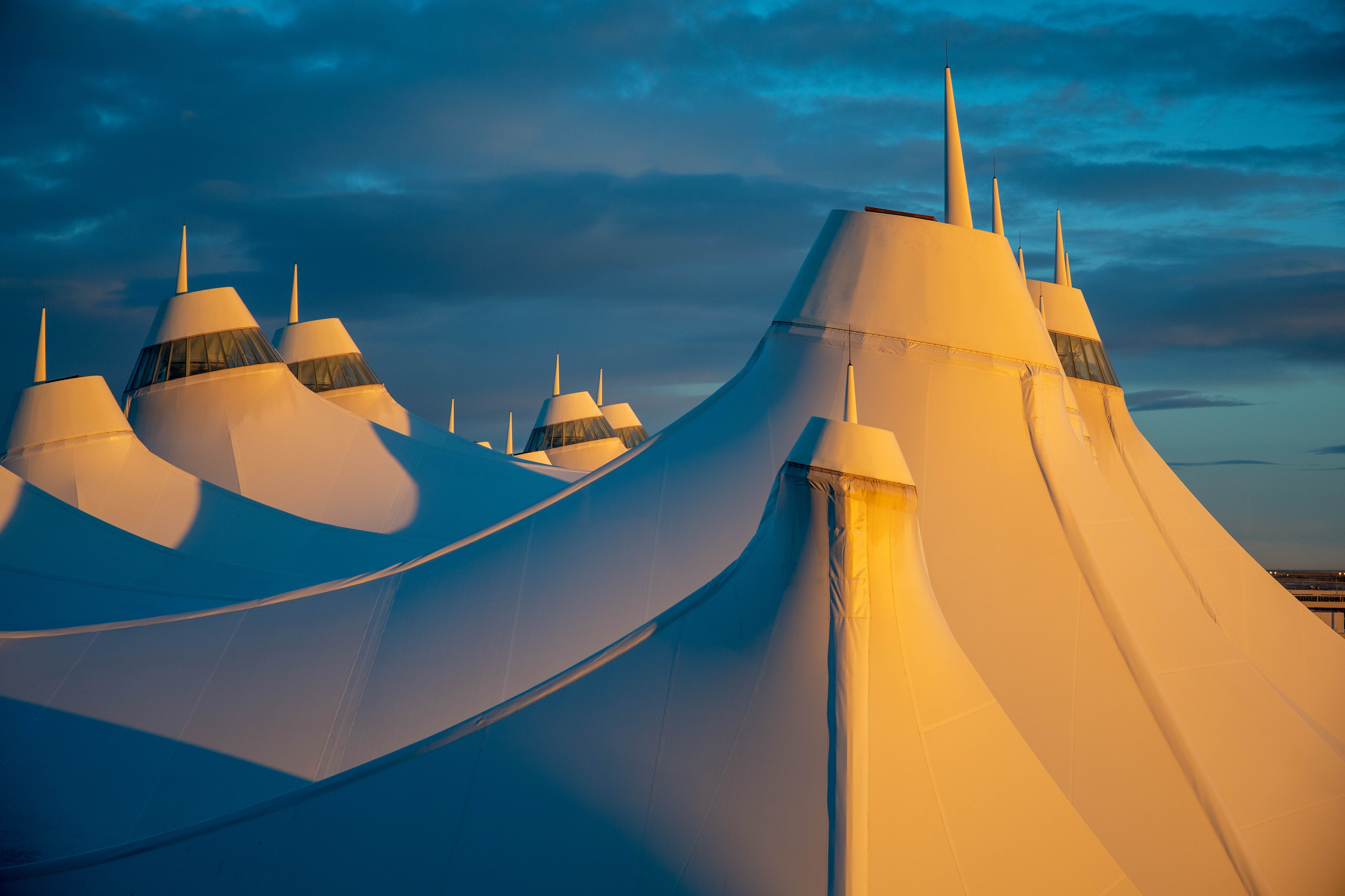 The teepee like exterior of Denver Airport in sunlight