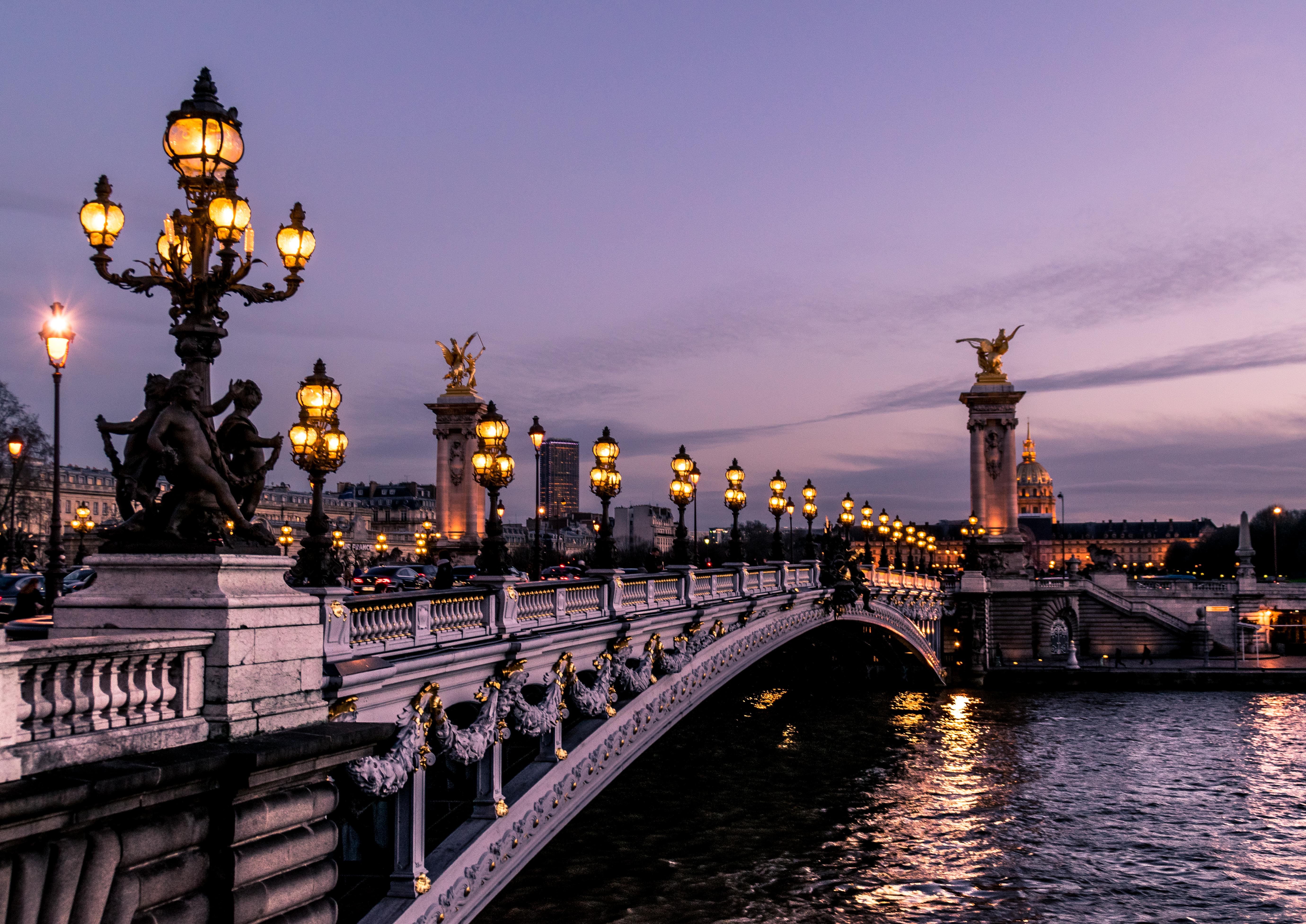 A romantic old bridge lit up with lamp posts