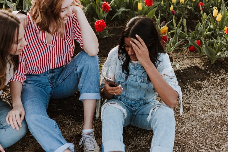 3 young people talking