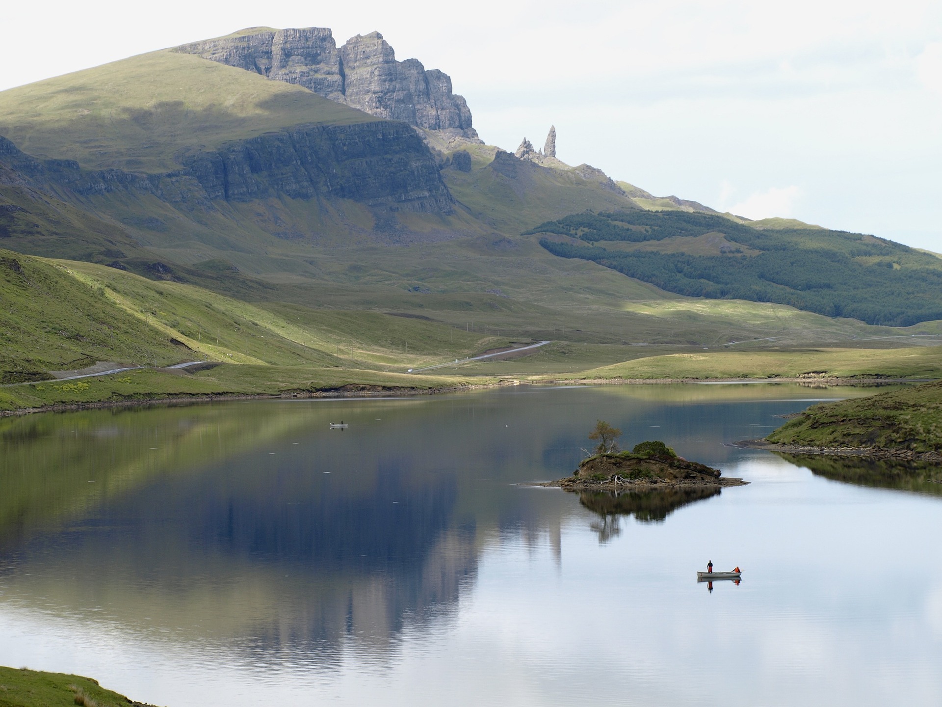 Hilly and rocky Scottish landscape with lake at front