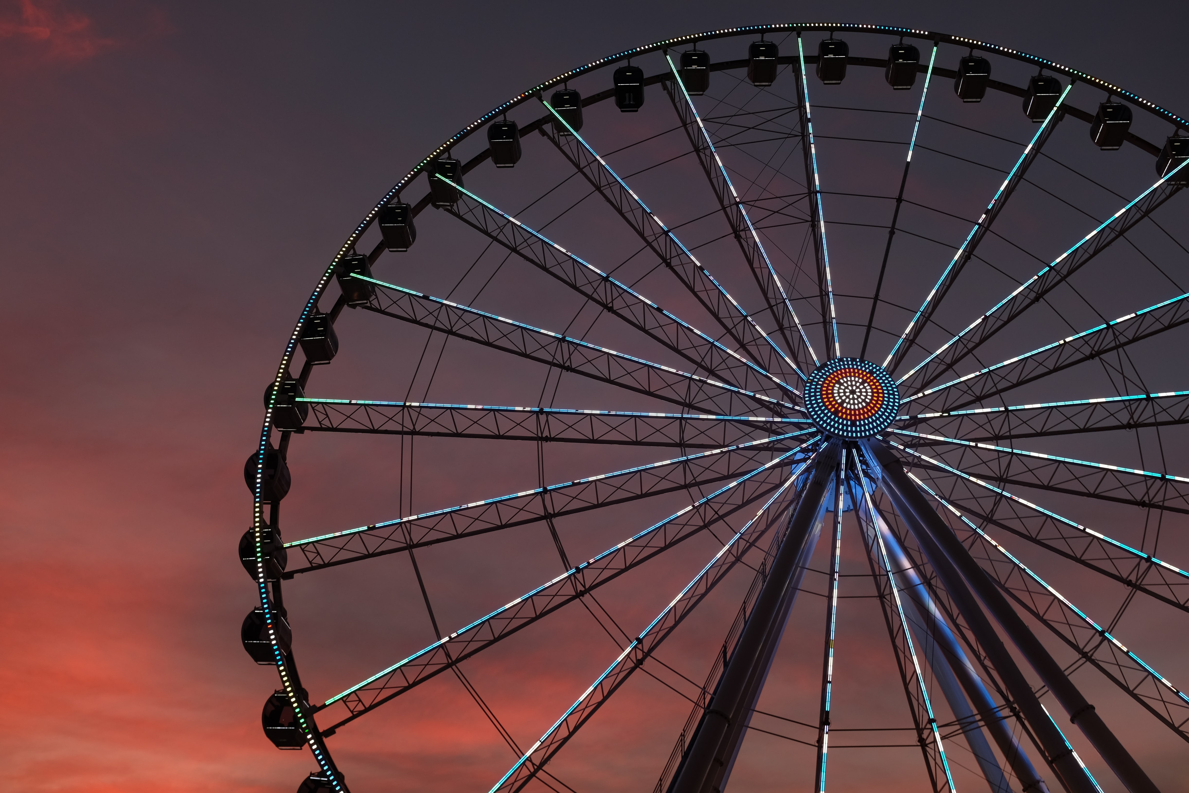 A Ferris wheel in the sunset.