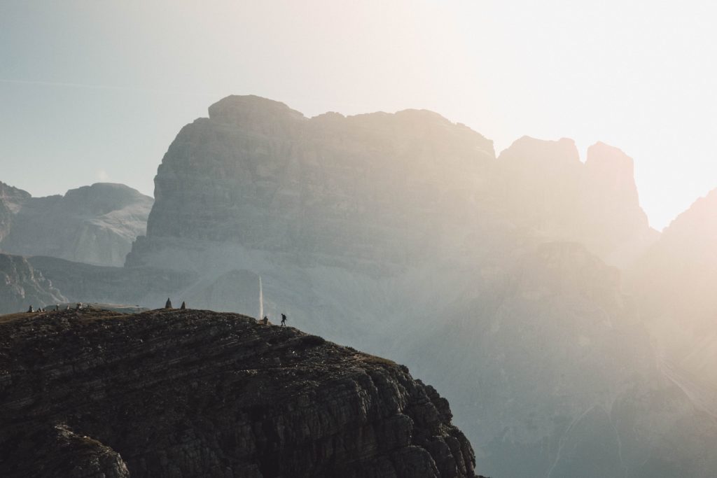 a shot of the landscapes in the Dolomites with mountains in a foggy light reason why you should start booking spring 2021