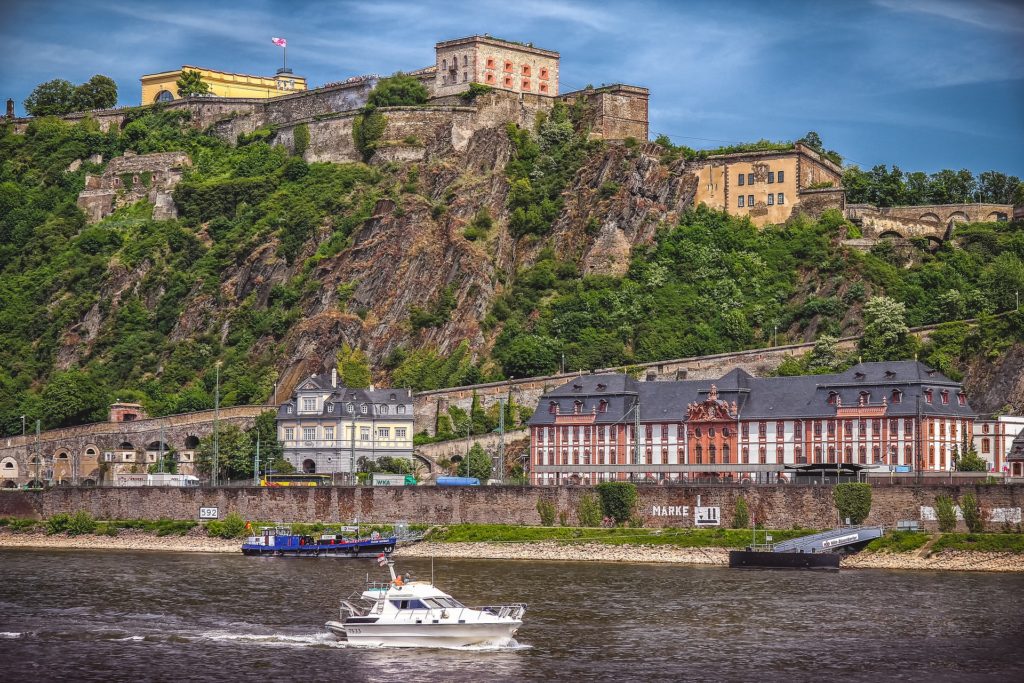 a city on top of a mountain by a lake located in one of the largest federal states in Germany