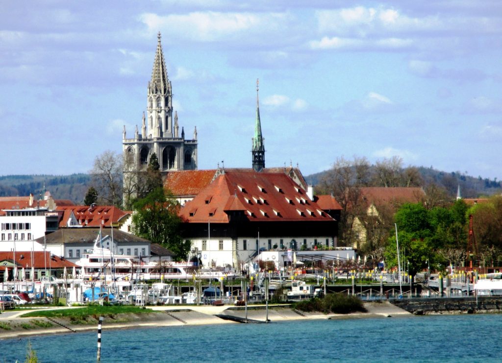 a shot of the city Costance with a cathedral in the background