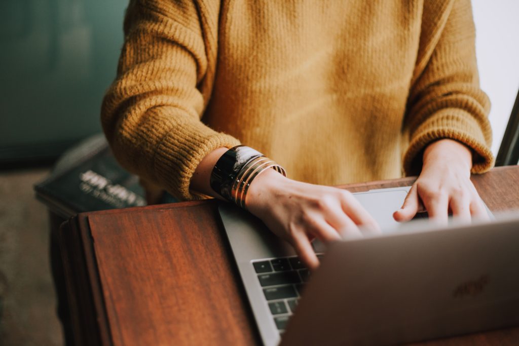 woman sat working on a laptop