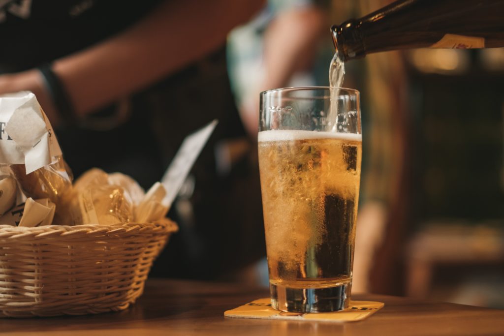 A pint of beer next to bread beer tour in Germany