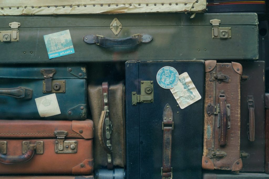 a stack of suitcases when becoming a TripLeader