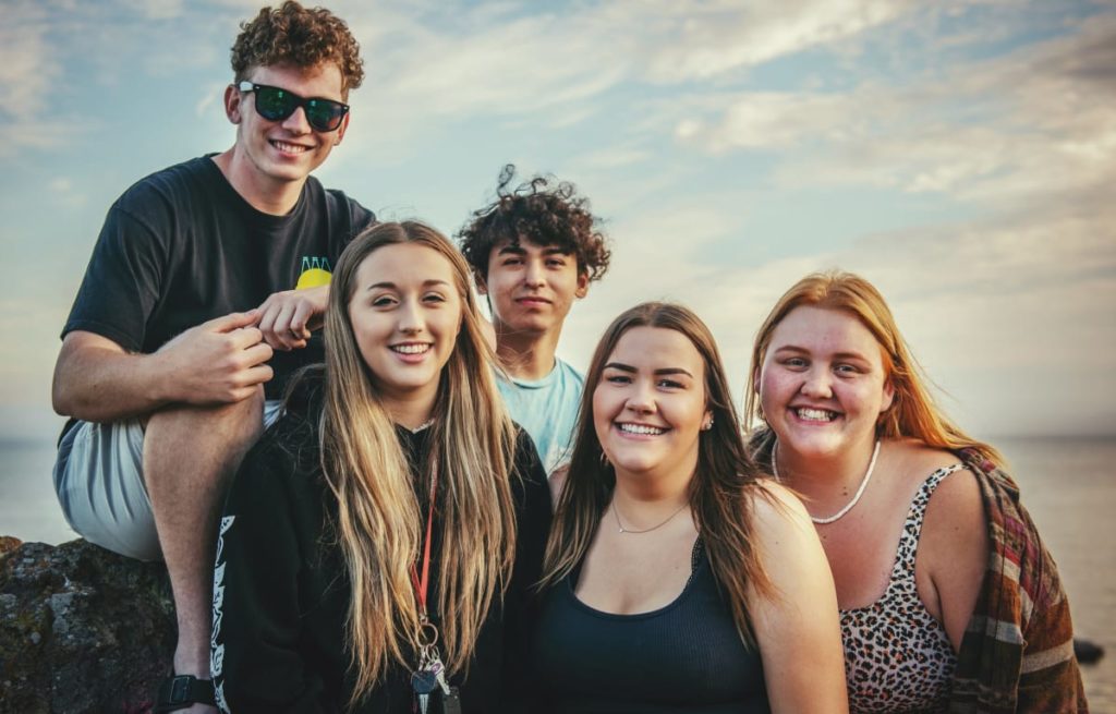 a group of friends smiling for the camera