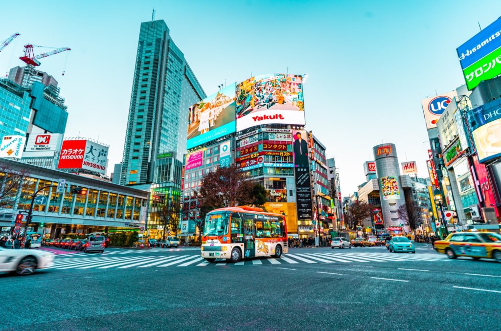 Tokyo, with colour posters and cars all around