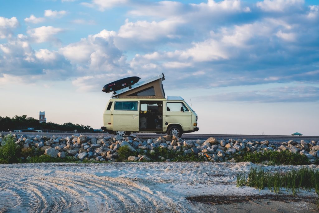 campervan on the side of the road parked up as the evening is setting. The perfect tip for a camper van trip.